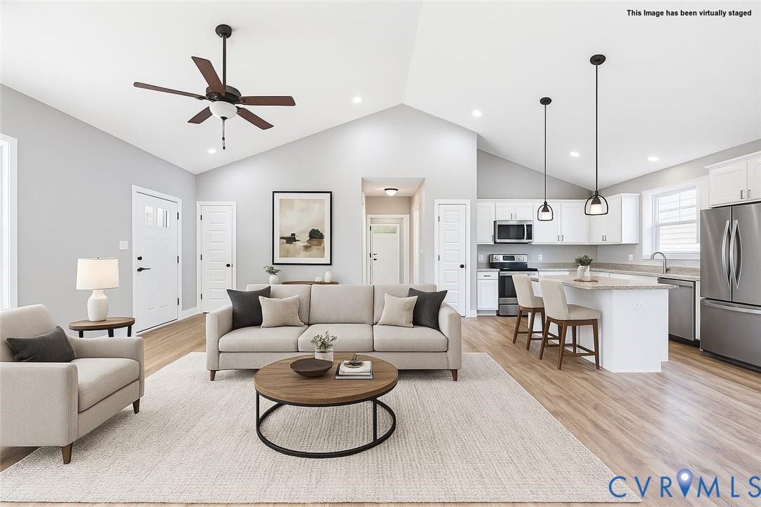 6795 Darlington Heights Road Cullen, VA 23934 - Photo 3 of 44 a living room with furniture kitchen view and a chandelier