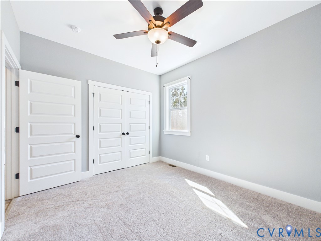 6795 Darlington Heights Road Cullen, VA 23934 - Photo 32 of 42 Unfurnished bedroom with a closet, ceiling fan, an