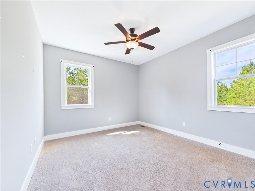 6795 Darlington Heights Road Cullen, VA 23934 - Photo 33 of 42 Carpeted spare room featuring baseboards and ceili