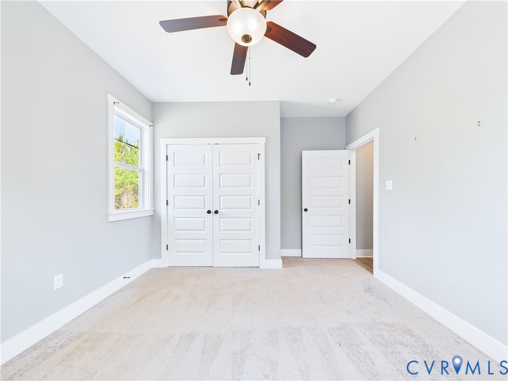 6795 Darlington Heights Road Cullen, VA 23934 - Photo 35 of 42 Unfurnished bedroom featuring light colored carpet