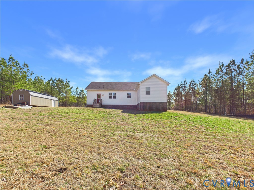 6795 Darlington Heights Road Cullen, VA 23934 - Photo 39 of 42 Back of house with an outbuilding and a lawn