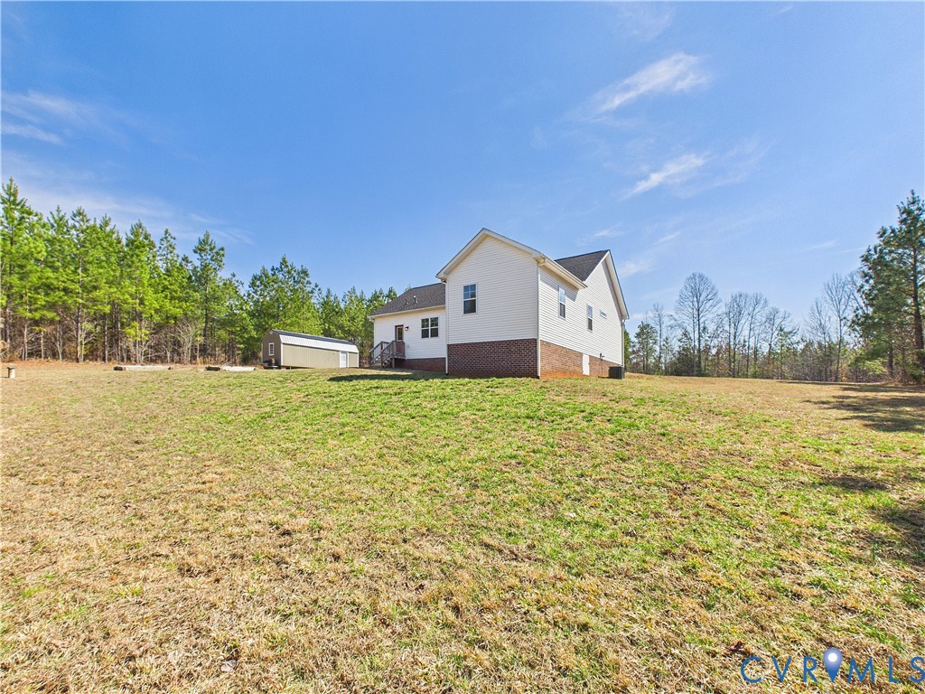 6795 Darlington Heights Road Cullen, VA 23934 - Photo 43 of 44 a house with trees in front of it