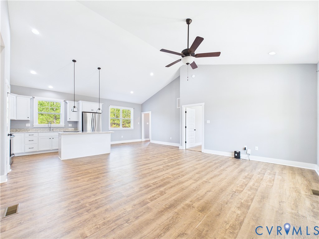 6795 Darlington Heights Road Cullen, VA 23934 - Photo 5 of 42 Unfurnished living room featuring lofted ceiling,