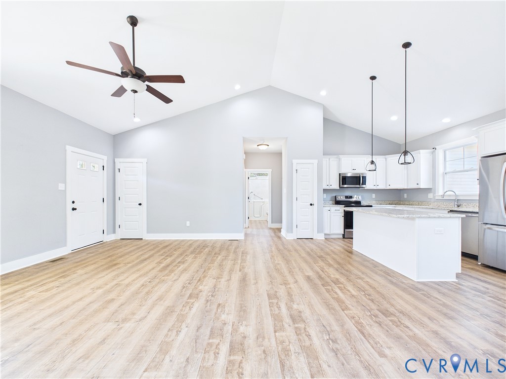 6795 Darlington Heights Road Cullen, VA 23934 - Photo 6 of 42 Unfurnished living room with light wood-style floo