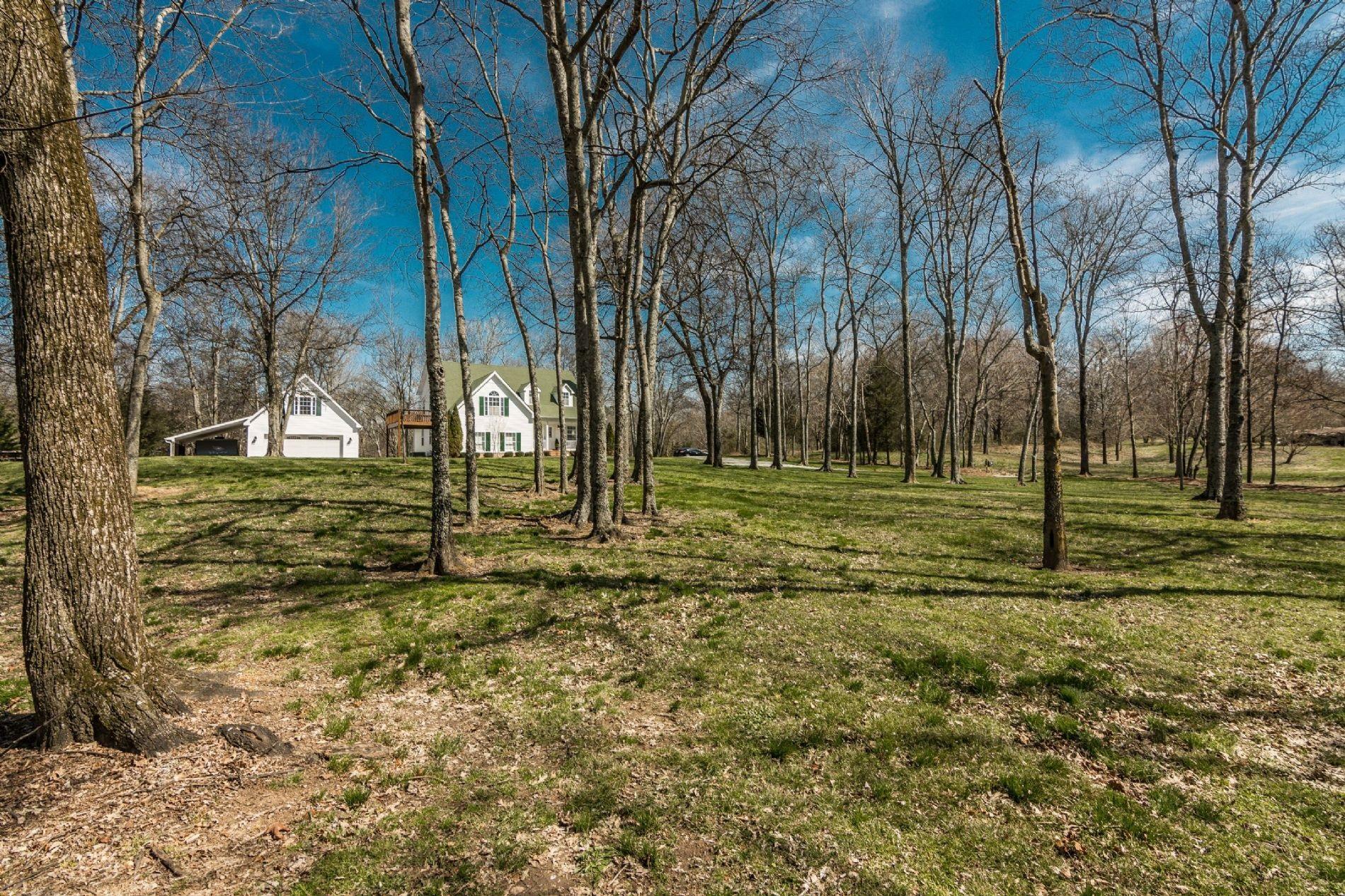 243 Village Green Road Gallatin, TN 37066 - Photo 2 of 24 a view of a golf ground with trees