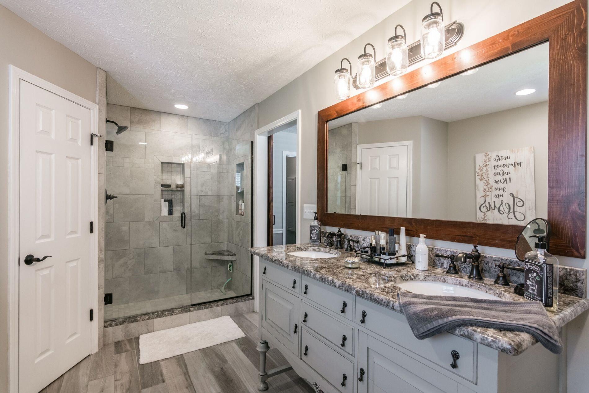 243 Village Green Road Gallatin, TN 37066 - Photo 12 of 24 a bathroom with a double vanity sink mirror double shower and a mirror