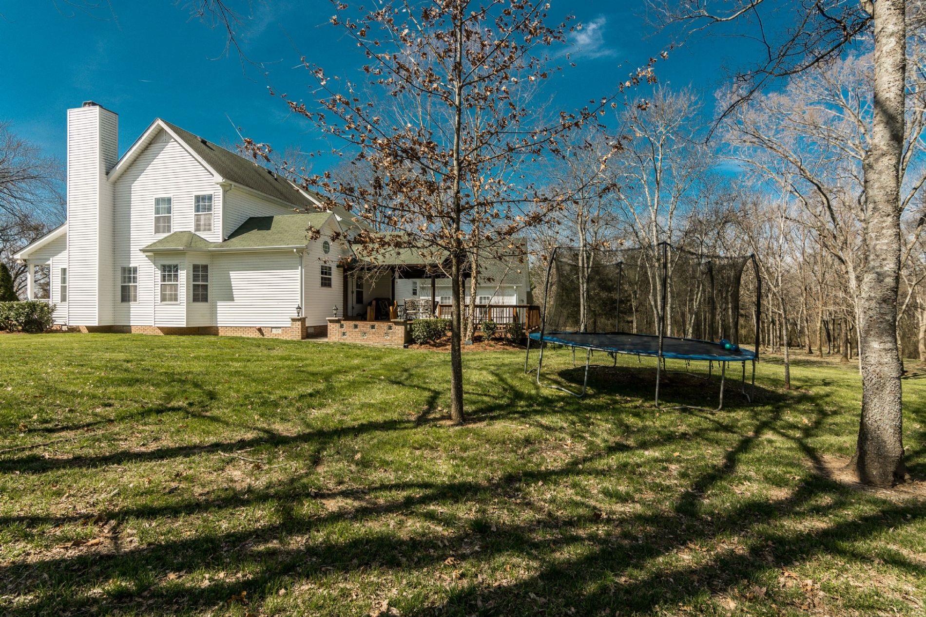 243 Village Green Road Gallatin, TN 37066 - Photo 5 of 24 a view of a house with a yard