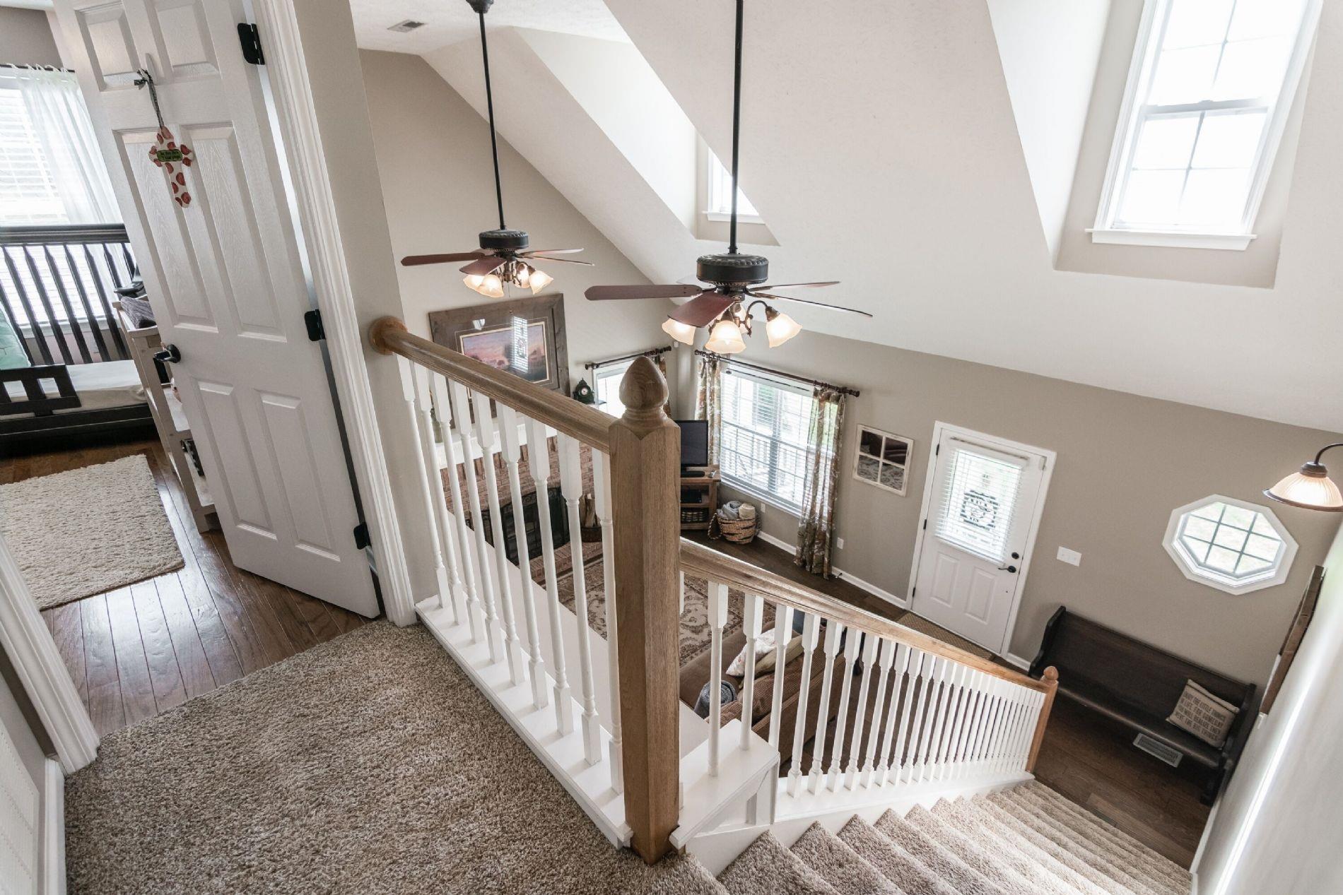 243 Village Green Road Gallatin, TN 37066 - Photo 6 of 24 a view of staircase with railing and a rug