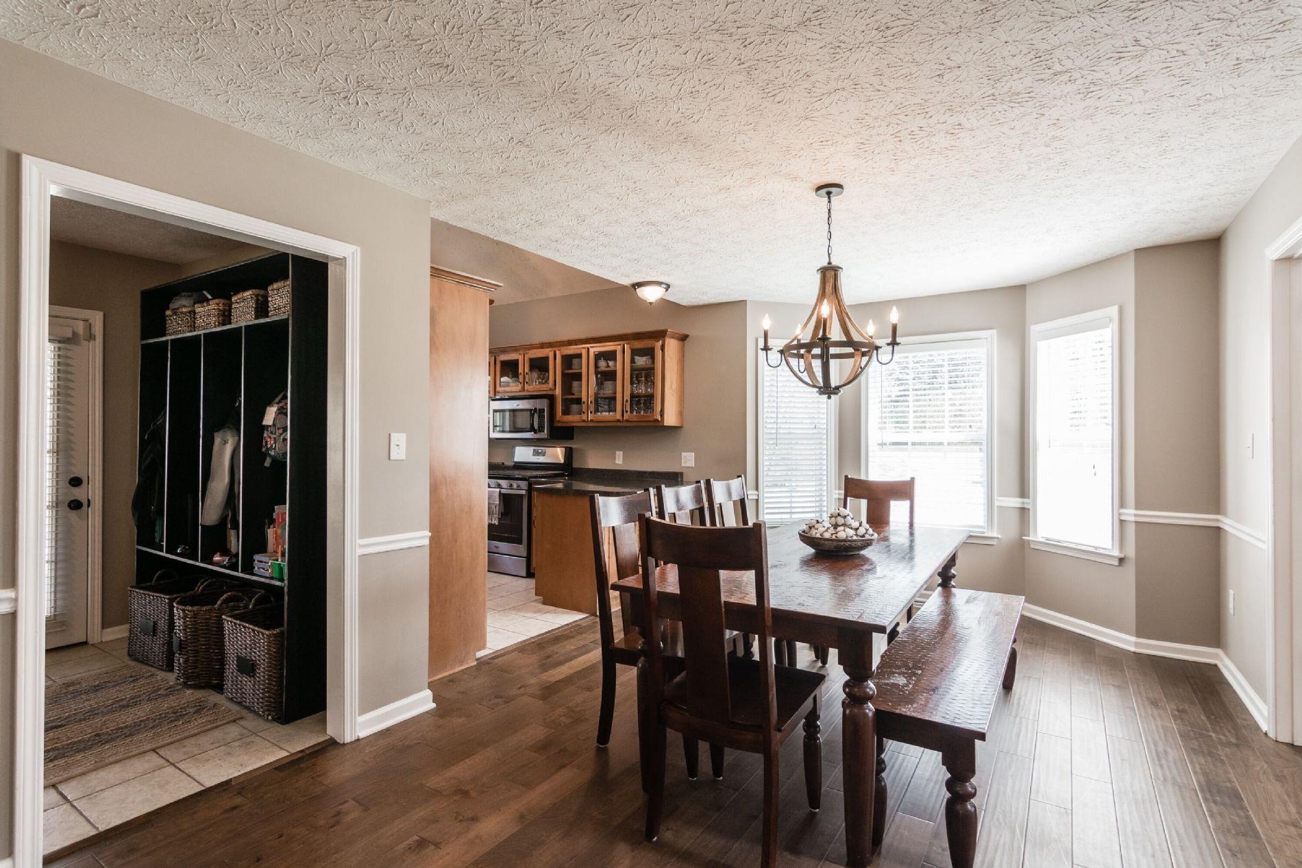 243 Village Green Road Gallatin, TN 37066 - Photo 7 of 24 a view of a dining room with furniture window and wooden floor