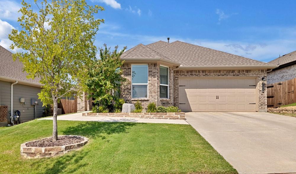 2216 Ruff Road Denton, TX 76205 - Photo 1 of 1 View of front of property with brick siding, roof with shingles, concrete driveway, and an attached garage