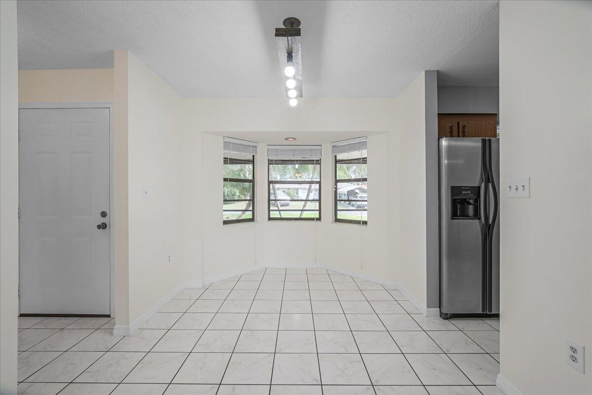 4514 Seattle Street Cocoa, FL 32927 - Photo 16 of 34 an empty room with windows and closet