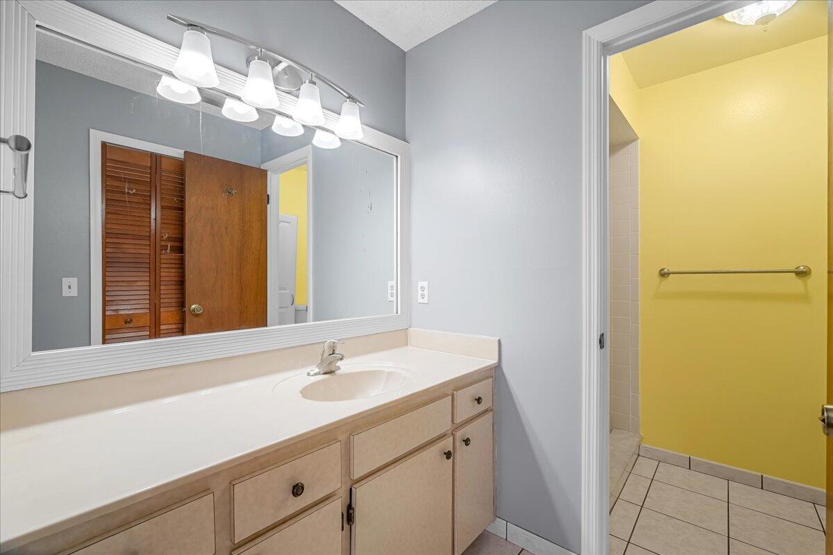 4514 Seattle Street Cocoa, FL 32927 - Photo 23 of 34 a bathroom with a sink and a mirror