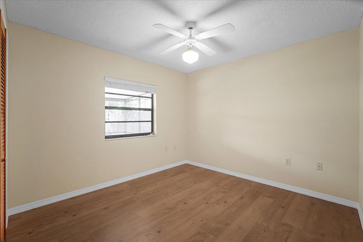 4514 Seattle Street Cocoa, FL 32927 - Photo 25 of 34 an empty room with a window and a fan