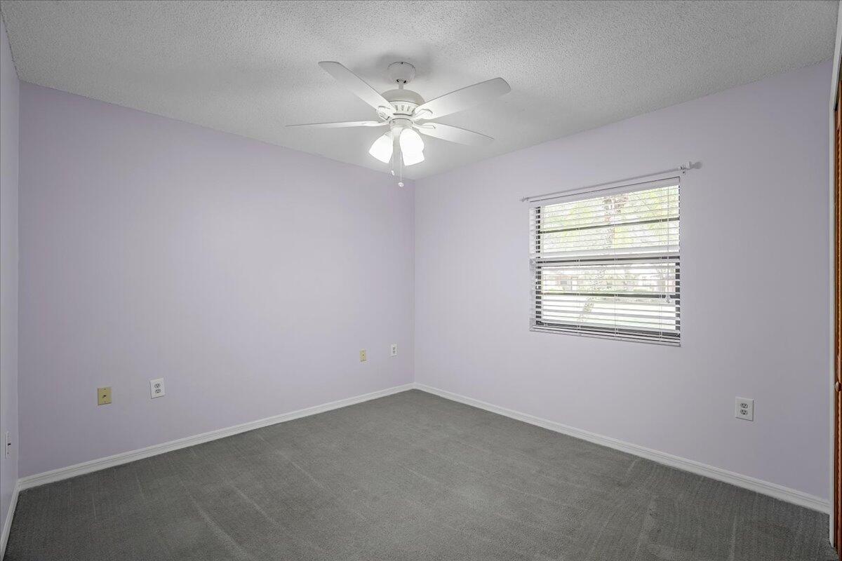 4514 Seattle Street Cocoa, FL 32927 - Photo 27 of 34 an empty room with a window and a fan