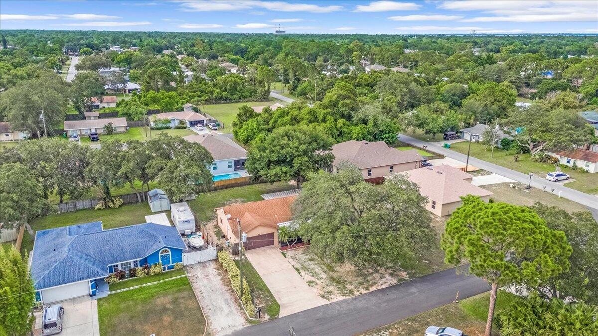4514 Seattle Street Cocoa, FL 32927 - Photo 4 of 34 an aerial view of a house with yard swimming pool and outdoor seating