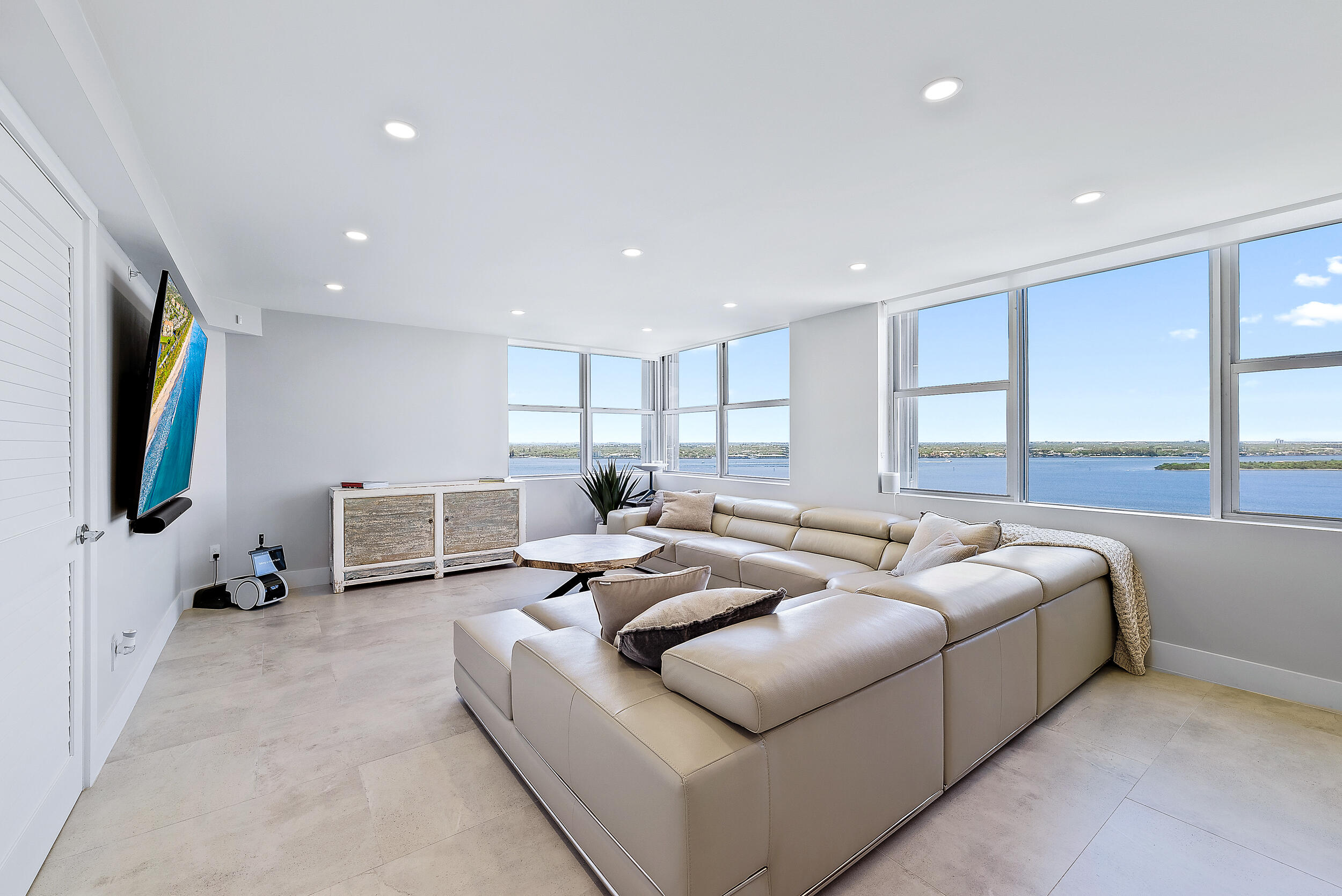5200 North Ocean Drive, Unit 2003 Singer Island, FL 33404 - Photo 11 of 40 a living room with furniture and a flat screen tv