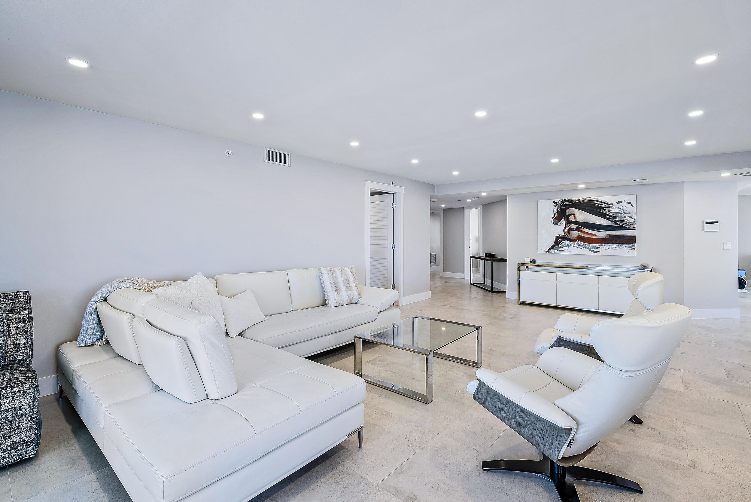 5200 North Ocean Drive, Unit 2003 Singer Island, FL 33404 - Photo 12 of 40 a living room with furniture and a wooden floor
