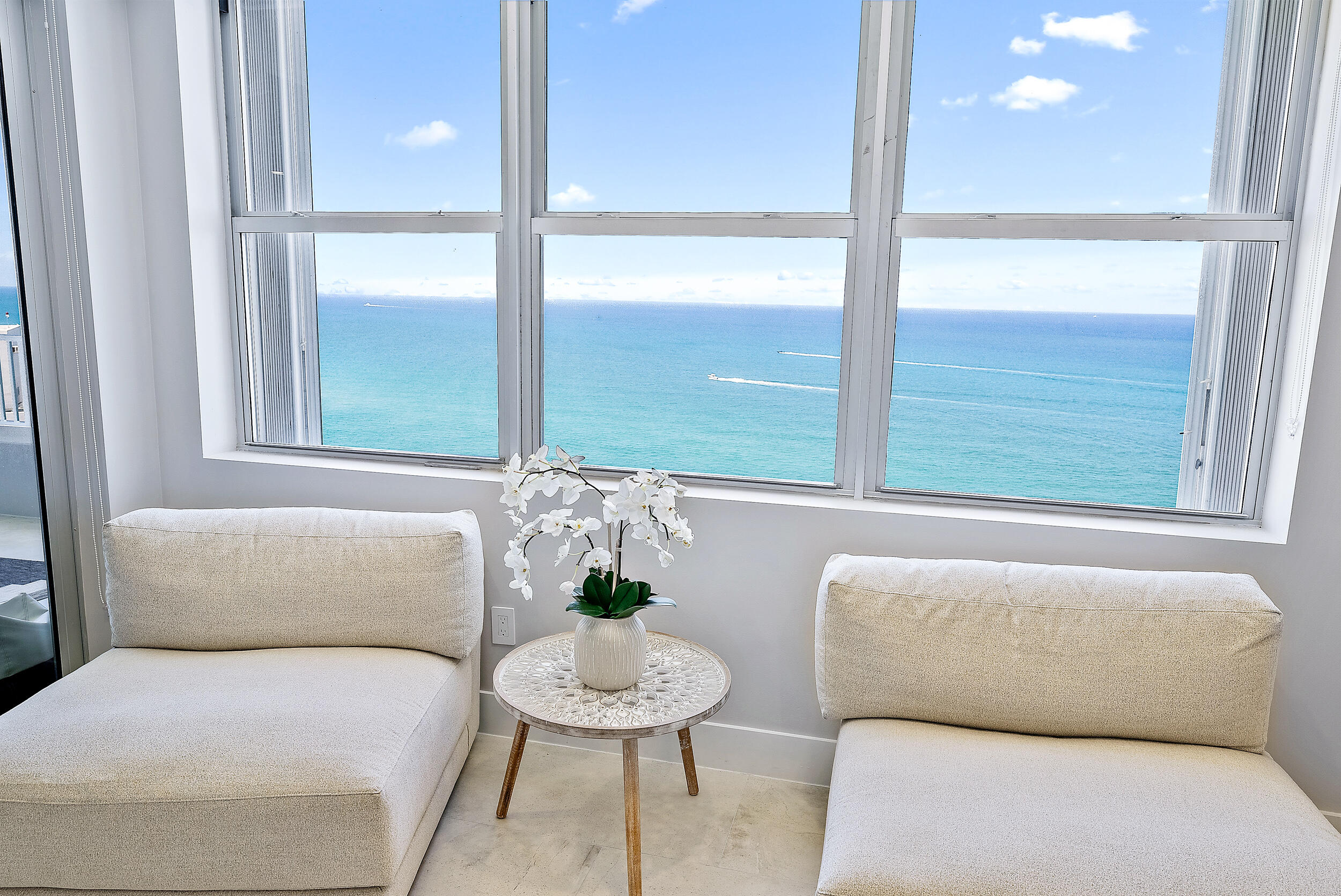 5200 North Ocean Drive, Unit 2003 Singer Island, FL 33404 - Photo 15 of 40 a living room with furniture and a window