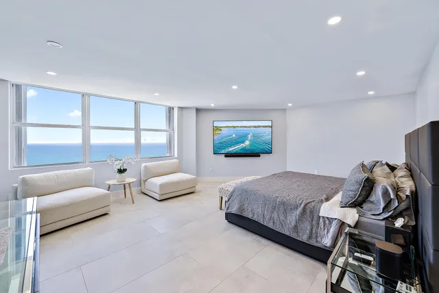 a spacious bathroom with a shower a sink and mirror