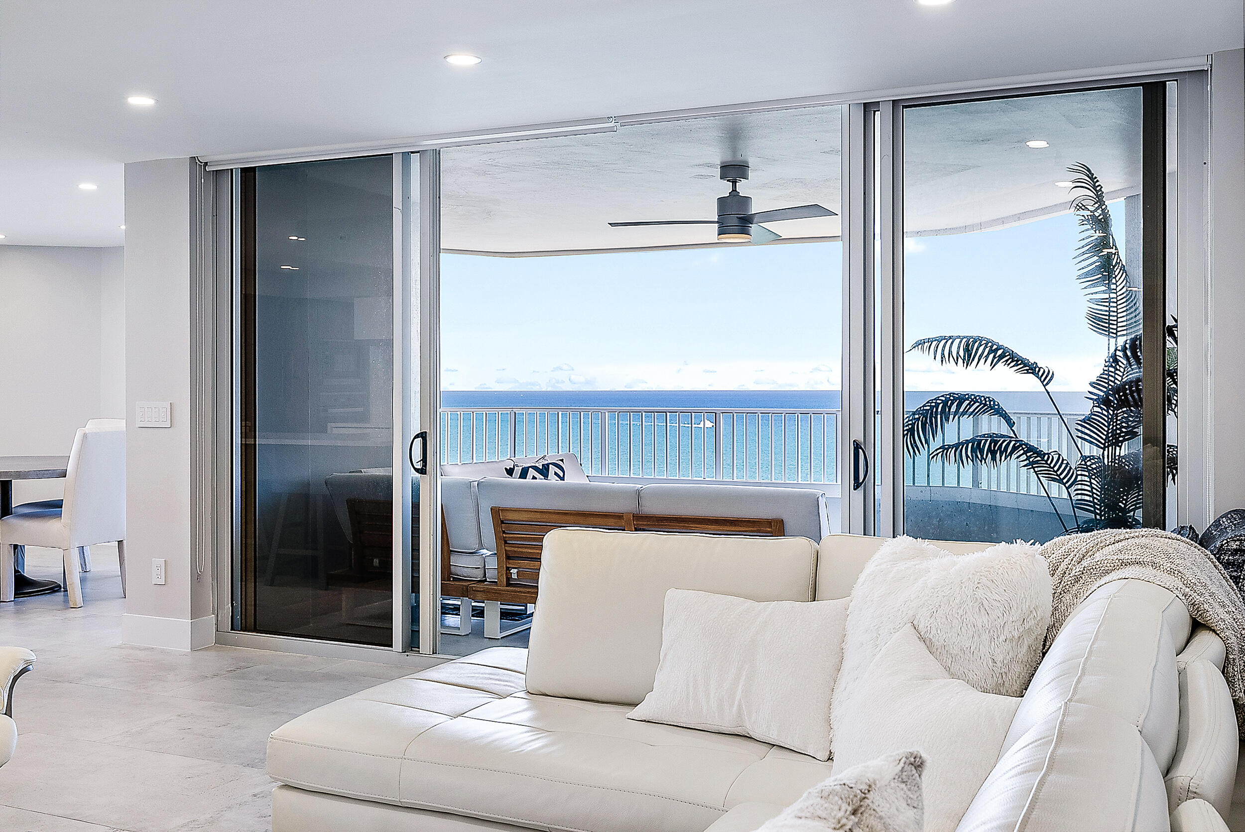 5200 North Ocean Drive, Unit 2003 Singer Island, FL 33404 - Photo 2 of 40 a living room with furniture and a fireplace
