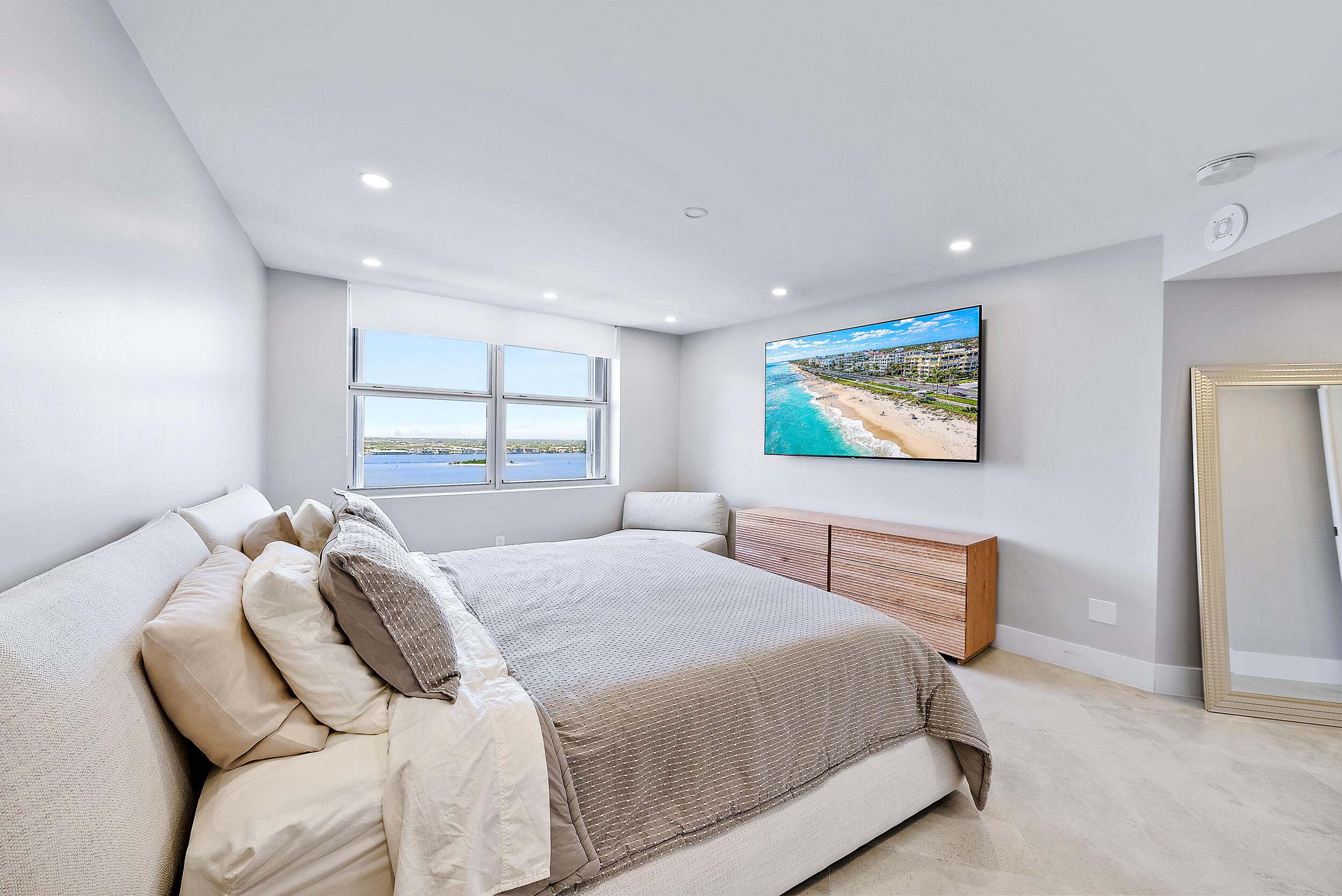 5200 North Ocean Drive, Unit 2003 Singer Island, FL 33404 - Photo 21 of 40 a bedroom with a bed and a window