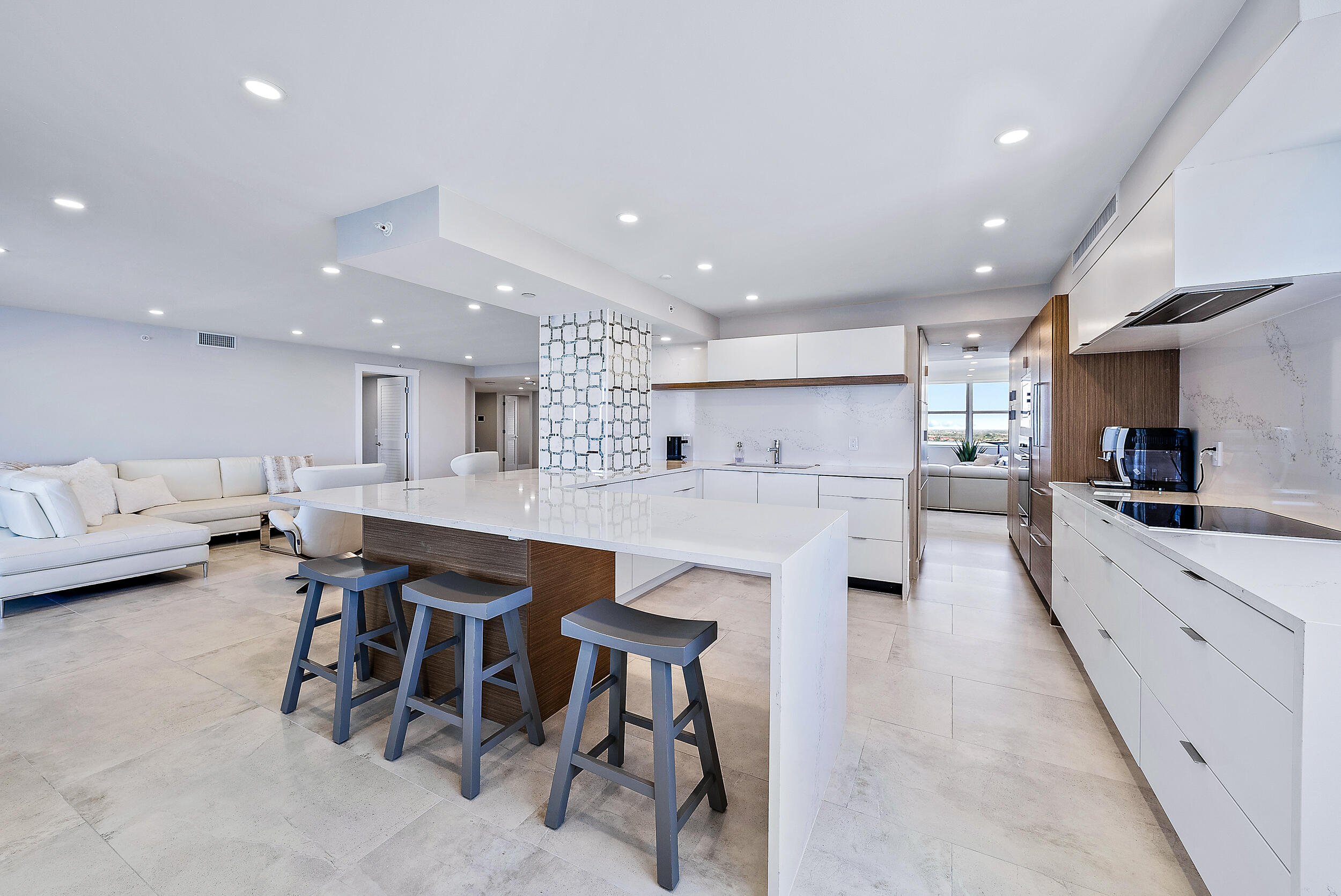 5200 North Ocean Drive, Unit 2003 Singer Island, FL 33404 - Photo 29 of 40 a kitchen with stainless steel appliances kitchen island granite countertop a sink and a refrigerator