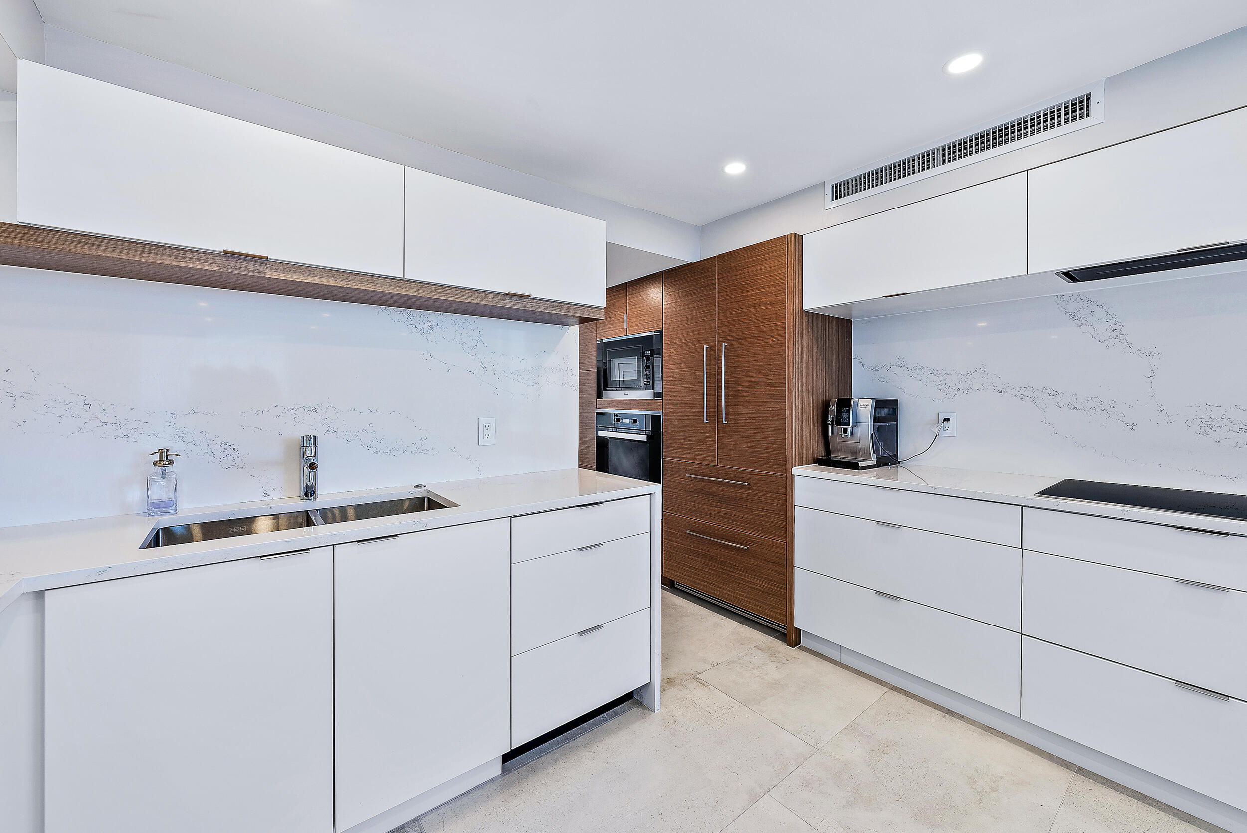 5200 North Ocean Drive, Unit 2003 Singer Island, FL 33404 - Photo 6 of 40 a kitchen with cabinets and appliances