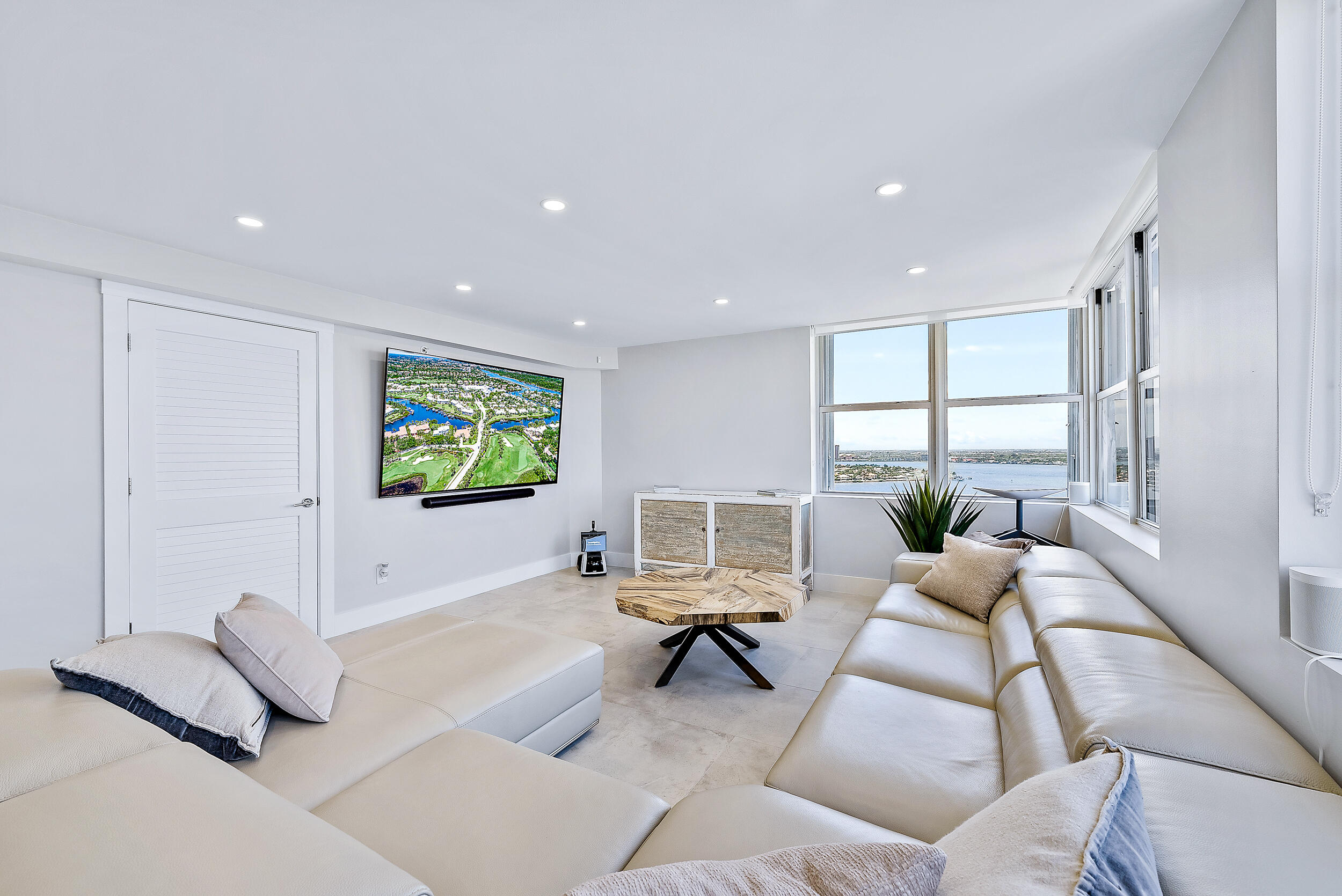 5200 North Ocean Drive, Unit 2003 Singer Island, FL 33404 - Photo 10 of 40 a living room with furniture and a flat screen tv