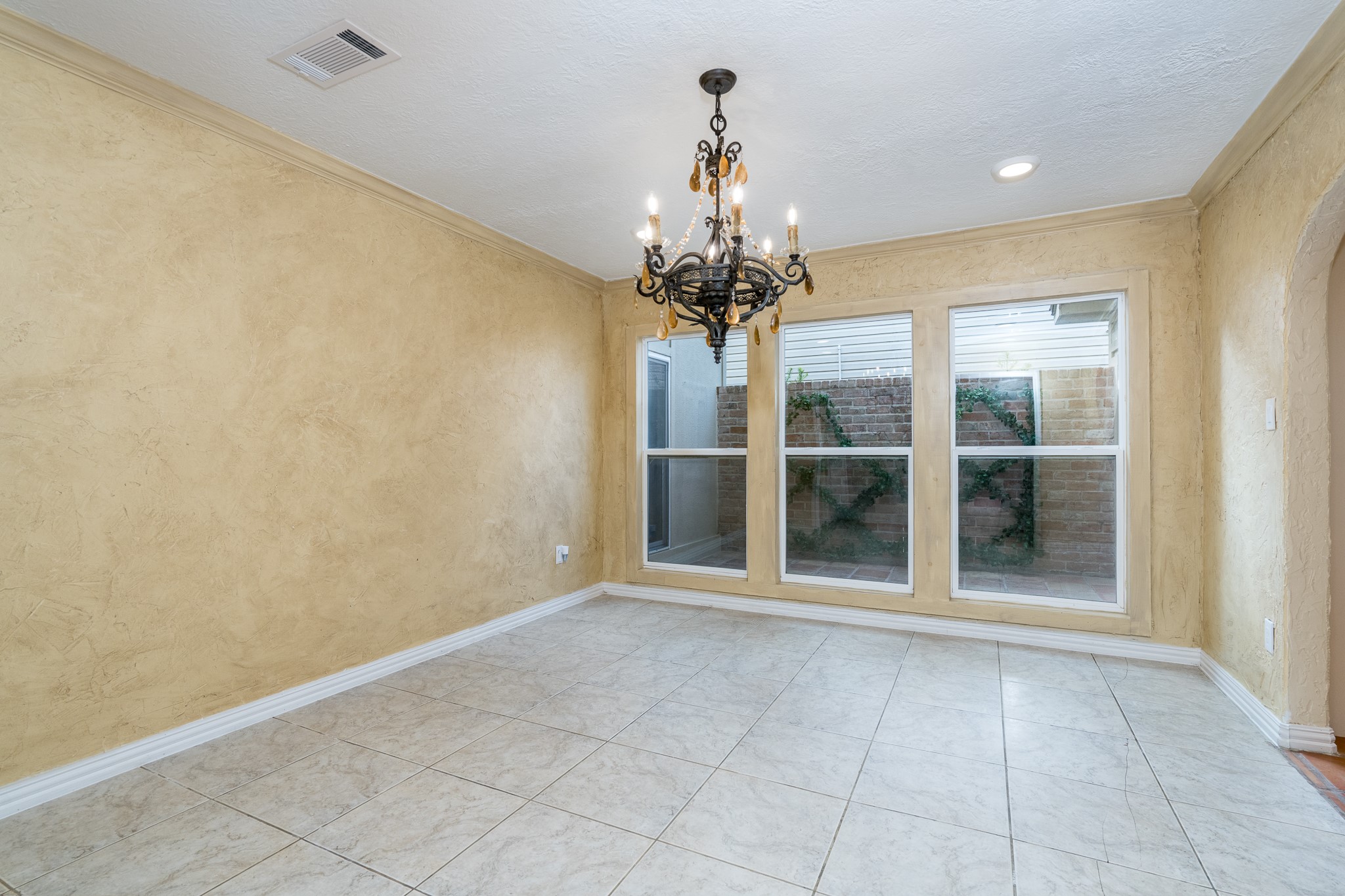 12835 Chimes Drive Houston, TX 77077 - Photo 19 of 45 a view of an empty room with a window