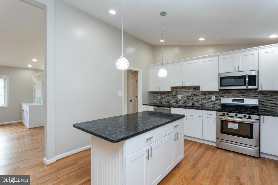 816 Hopewood Road Baltimore, MD 21208 - Photo 9 of 41 Check out the Fancy penlights over the island