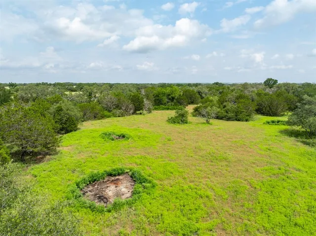 a view of a lake with a yard