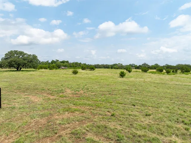 a view of a lake with a big yard