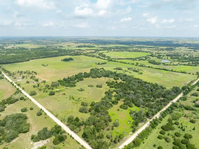 a view of a yard with an ocean view