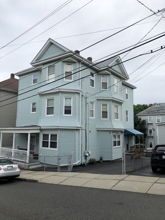 430 Hope Street Fall River, MA 02721 - Photo 1 of 28 a front view of a house with a road