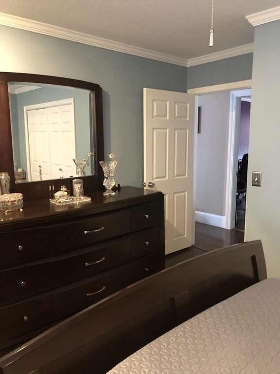 430 Hope Street Fall River, MA 02721 - Photo 11 of 28 a bedroom with a bed and a dresser
