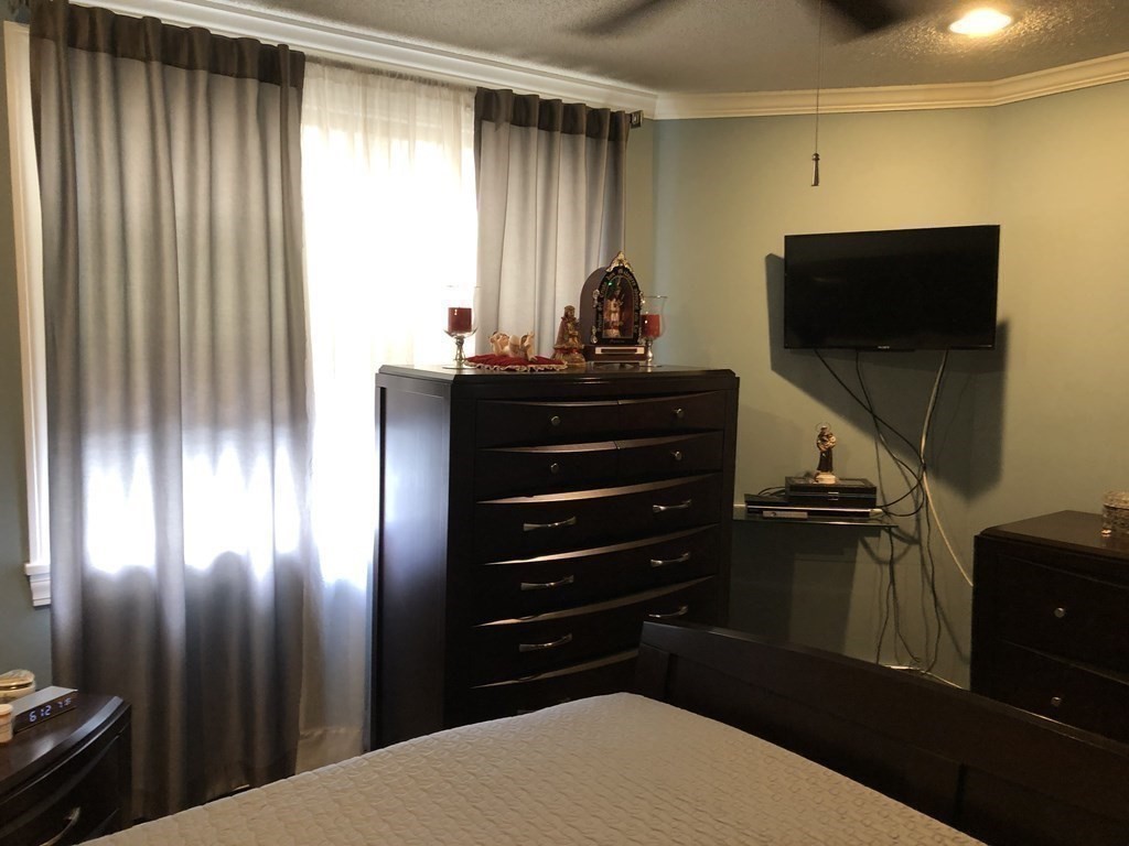 430 Hope Street Fall River, MA 02721 - Photo 18 of 28 a room with two chairs and a flat screen tv