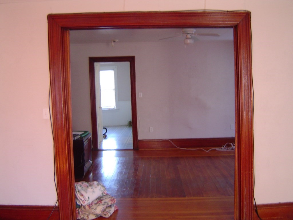 430 Hope Street Fall River, MA 02721 - Photo 25 of 28 a view of empty room with wooden floor