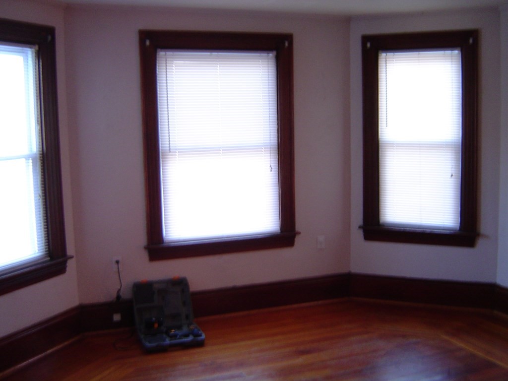 430 Hope Street Fall River, MA 02721 - Photo 26 of 28 a room with a window and wooden floor