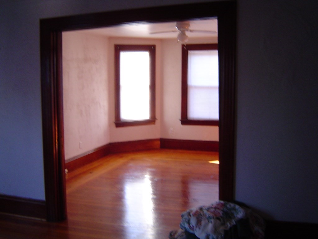 430 Hope Street Fall River, MA 02721 - Photo 27 of 28 a view of empty room with wooden floor and fan