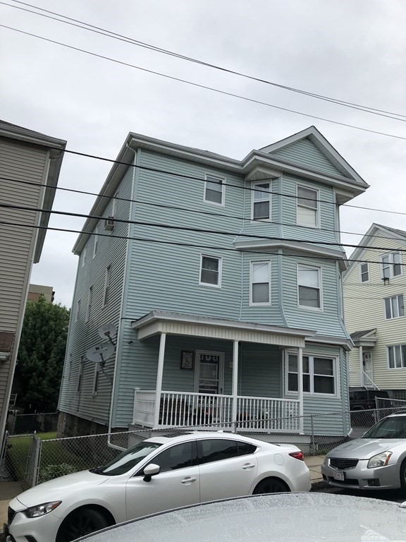 430 Hope Street Fall River, MA 02721 - Photo 3 of 28 a front view of a house with a garden