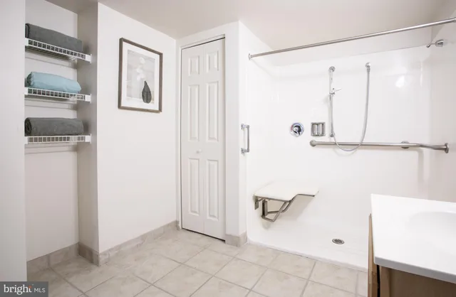 a bathroom with a shower and a sink