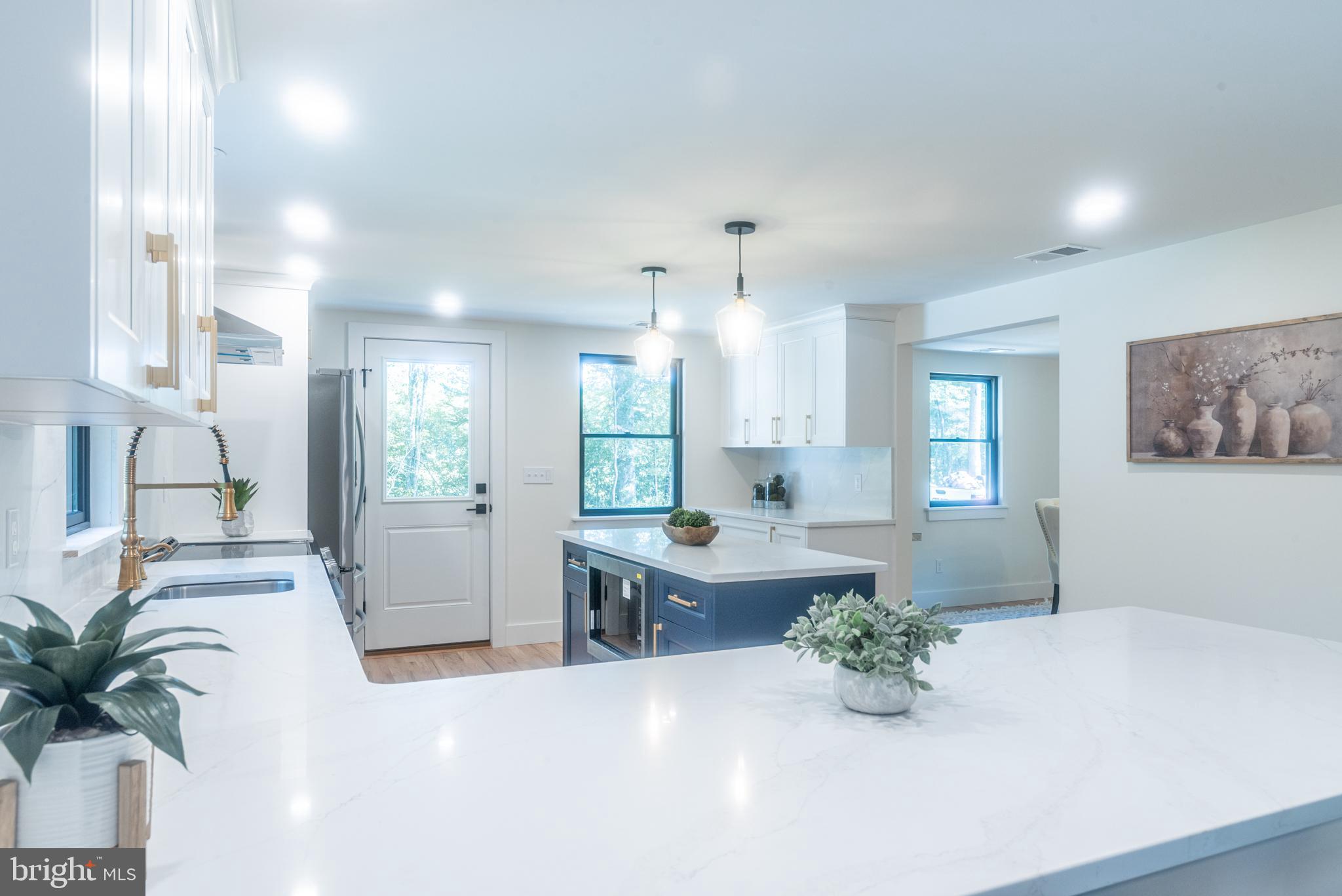 933 Forrest Road Sellersville, PA 18960 - Photo 14 of 56 a large white kitchen with a large window