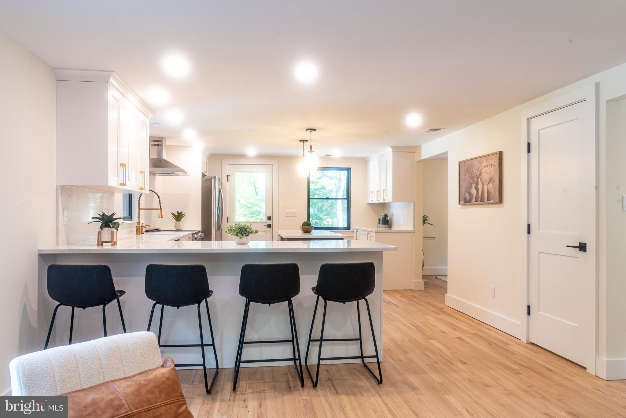 933 Forrest Road Sellersville, PA 18960 - Photo 15 of 56 a kitchen with a table and chairs in it