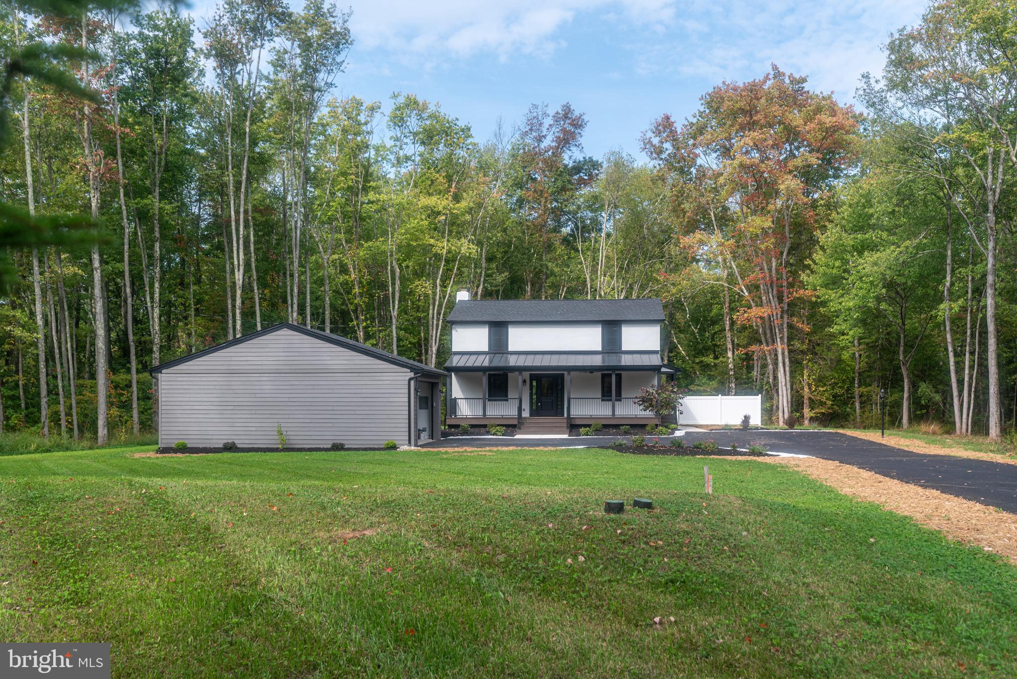 933 Forrest Road Sellersville, PA 18960 - Photo 2 of 56 a view of a house with a yard and sitting area