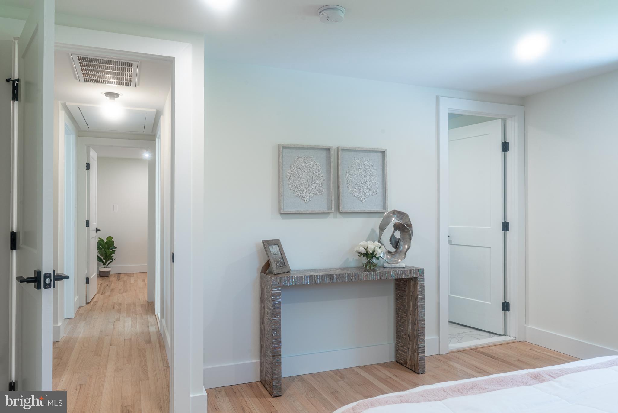933 Forrest Road Sellersville, PA 18960 - Photo 31 of 56 a room with a mirror and a table