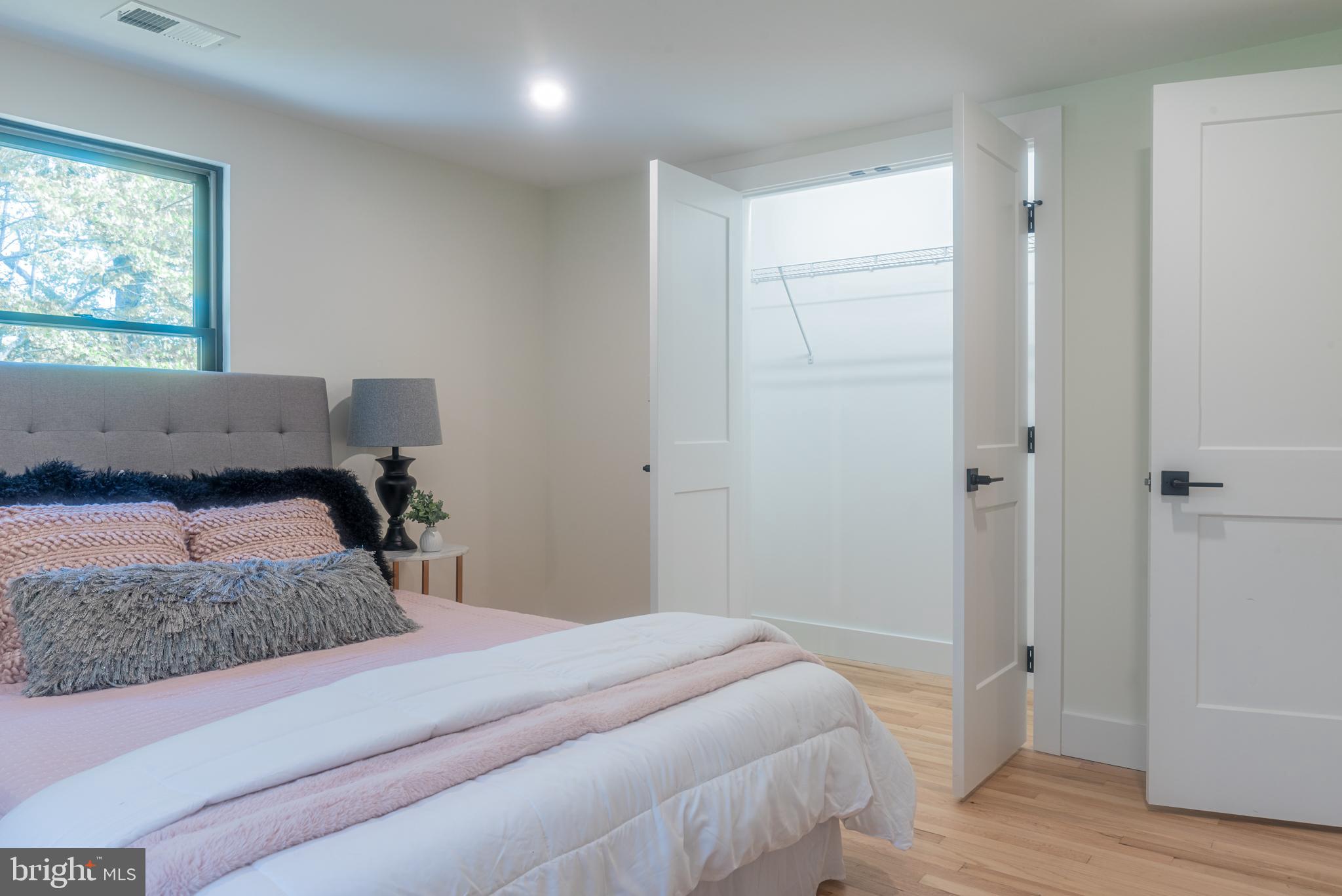 933 Forrest Road Sellersville, PA 18960 - Photo 32 of 56 a bedroom with a bed and a painting on the wall