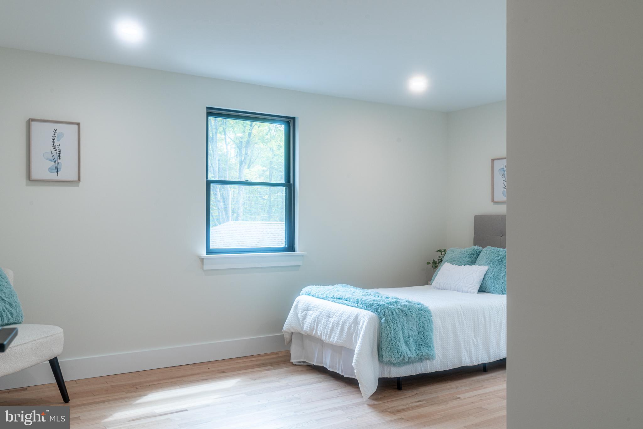 933 Forrest Road Sellersville, PA 18960 - Photo 38 of 56 a bedroom with a bed and a window