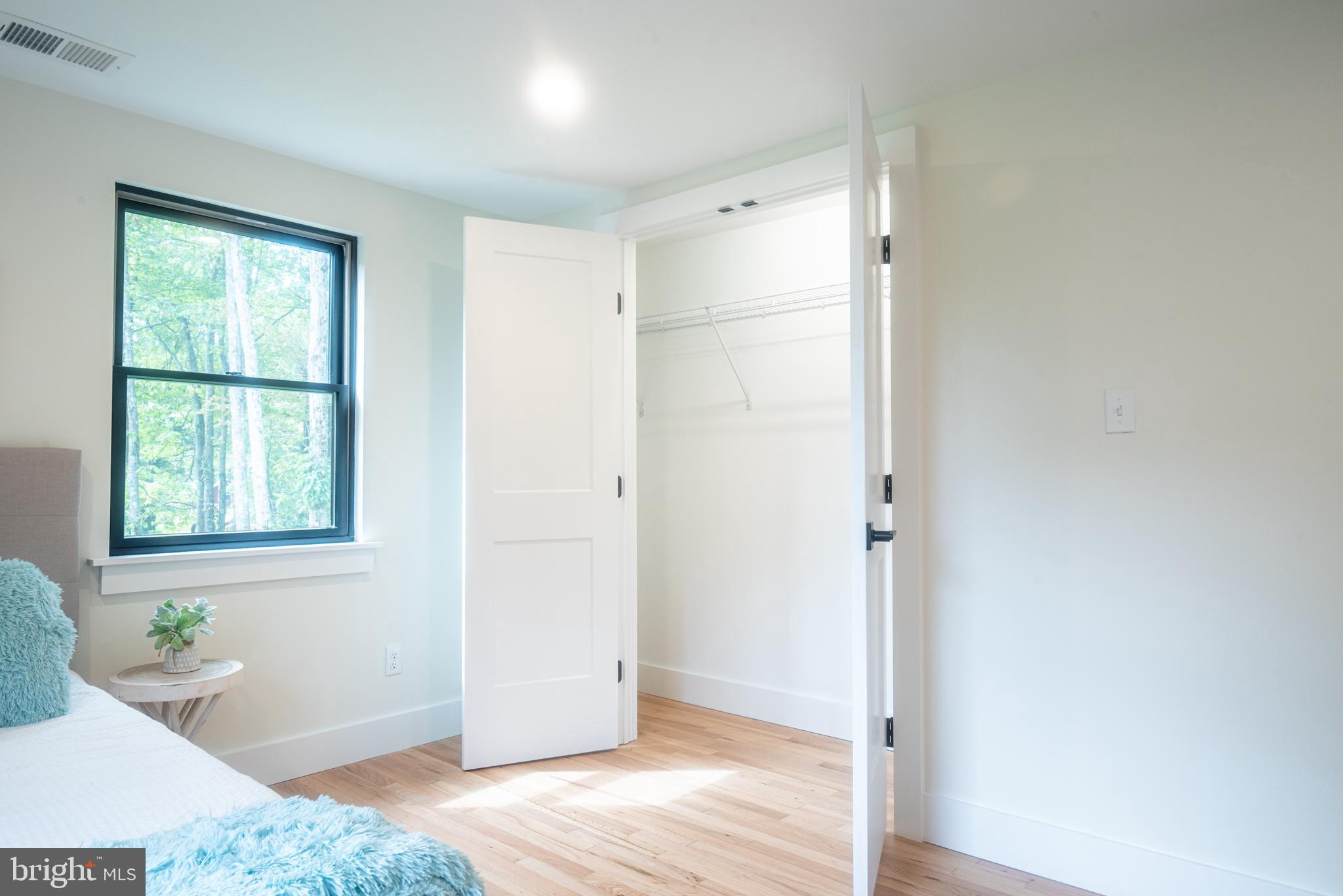 933 Forrest Road Sellersville, PA 18960 - Photo 40 of 56 a view of a bedroom with wooden floor and a window