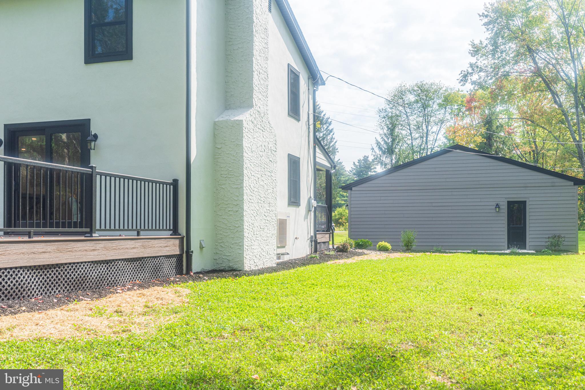 933 Forrest Road Sellersville, PA 18960 - Photo 52 of 56 a backyard of a house with yard and outdoor seating