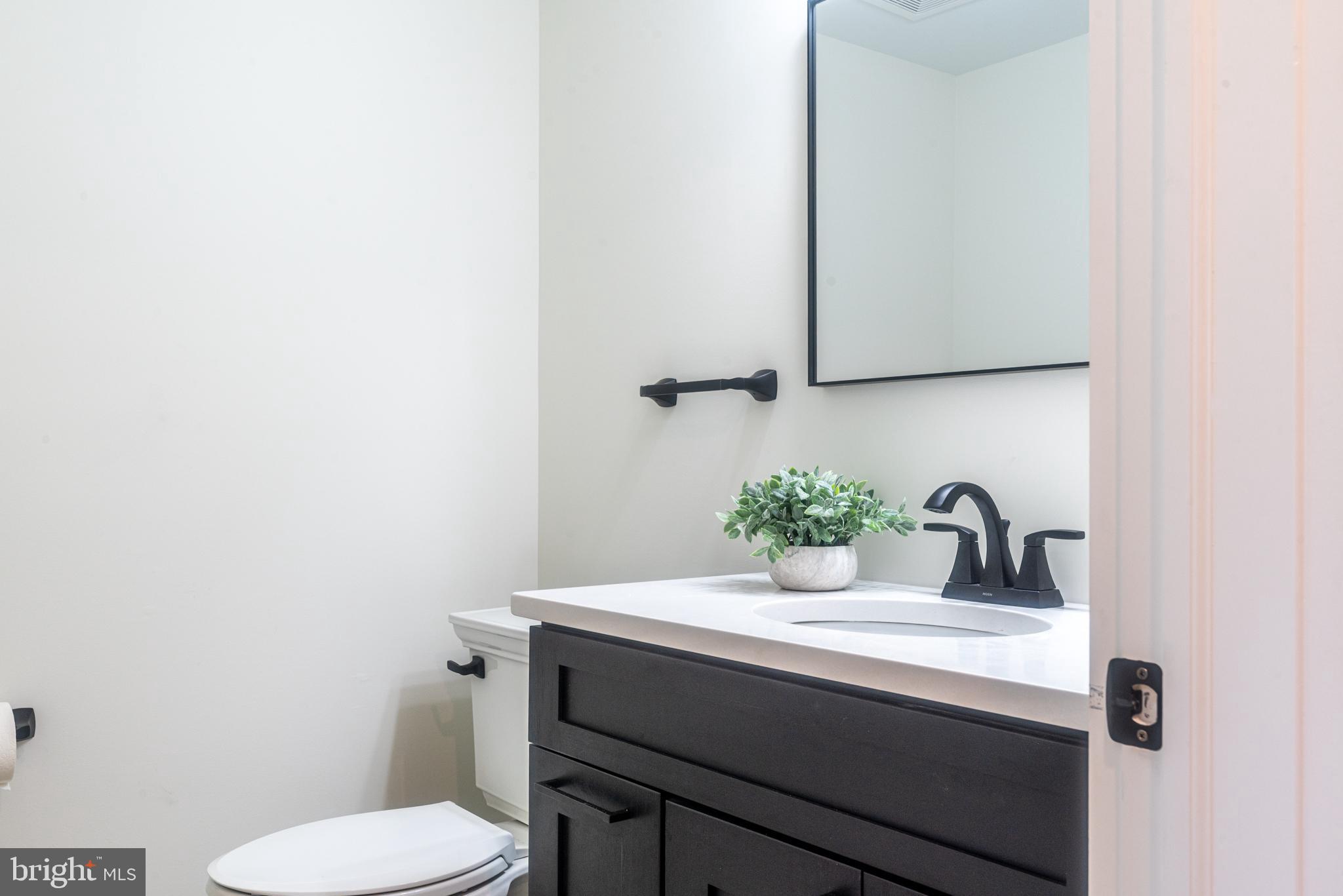 933 Forrest Road Sellersville, PA 18960 - Photo 7 of 56 a bathroom with a sink and a toilet